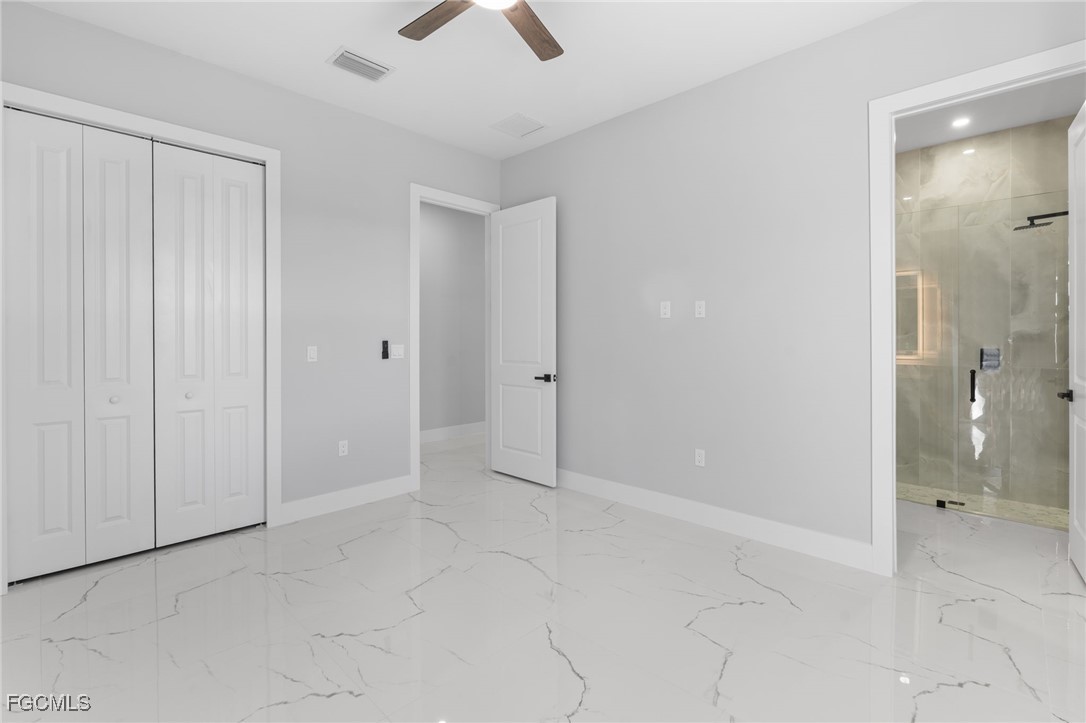 2603 3rd Street Southwest Lehigh Acres, FL 33976 - Photo 9 of 28 an empty room with an entryway