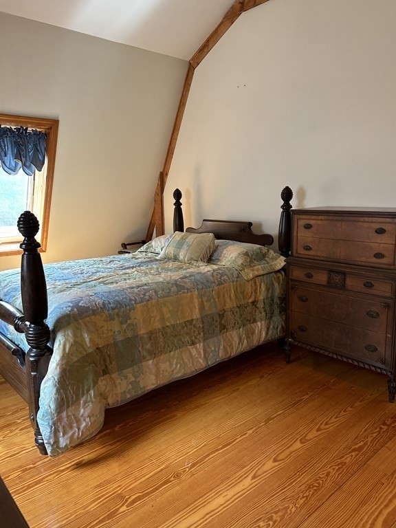 59 Paradise Lake Road Monson, MA 01057 - Photo 11 of 30 a bedroom with a bed and wooden floor