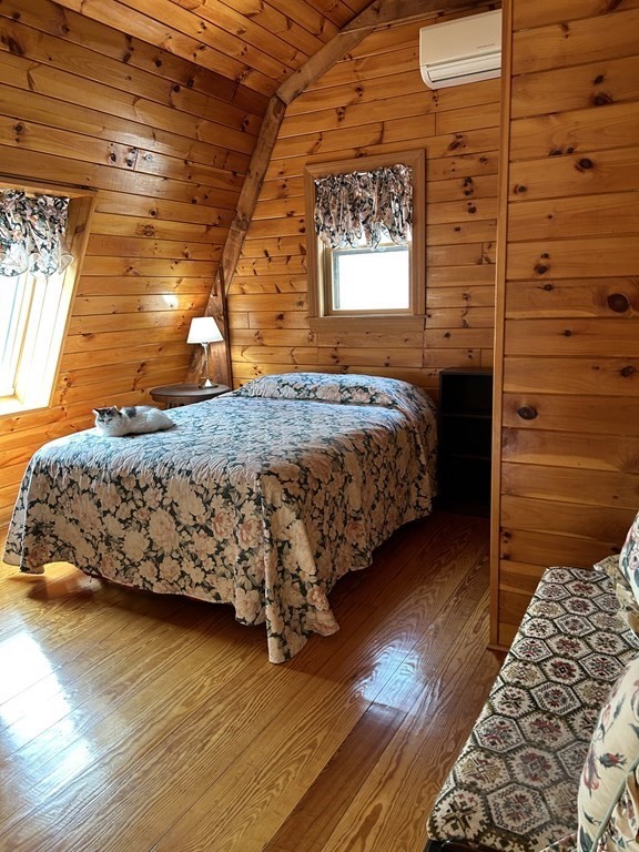 59 Paradise Lake Road Monson, MA 01057 - Photo 13 of 30 a bed sitting in a bedroom next to a window