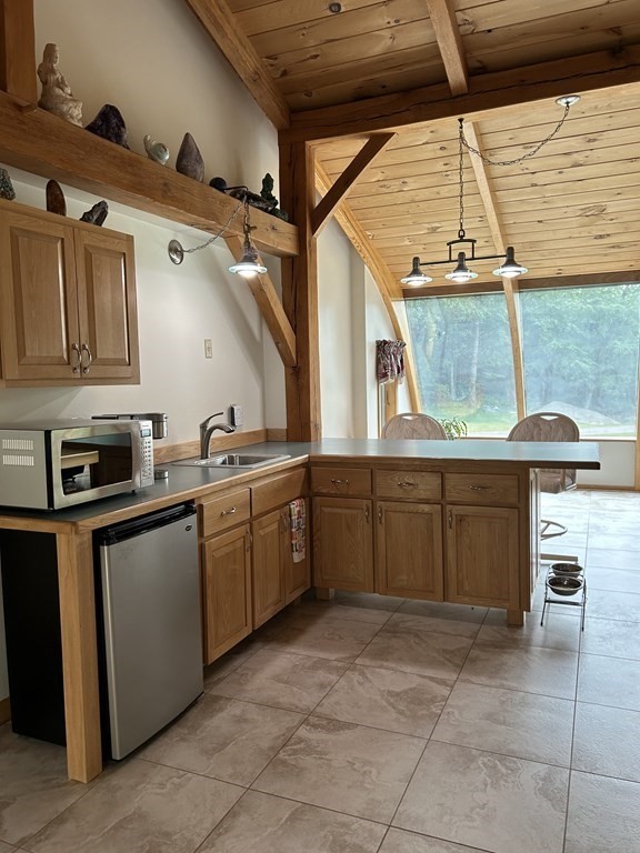 59 Paradise Lake Road Monson, MA 01057 - Photo 15 of 30 a kitchen with a stove and cabinets