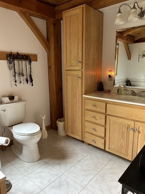 59 Paradise Lake Road Monson, MA 01057 - Photo 18 of 30 a bathroom with a toilet sink and mirror