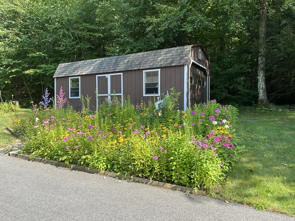 59 Paradise Lake Road Monson, MA 01057 - Photo 4 of 30 a view of a house with a yard and garden