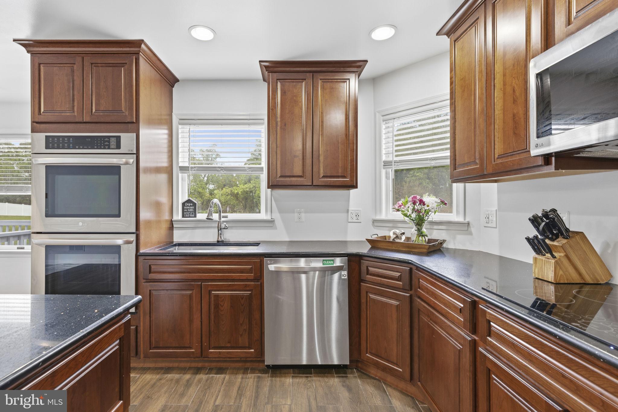 65 Watters Road New Park, PA 17352 - Photo 15 of 52 Elegant kitchen with rich wood tones.