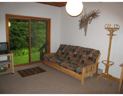582 Pfersick Road Ashfield, MA 01370 - Photo 19 of 23 a bed sitting in a room next to a window