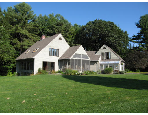 582 Pfersick Road Ashfield, MA 01370 - Photo 2 of 23 a front view of a house with a garden