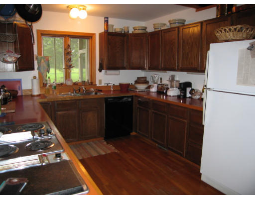 582 Pfersick Road Ashfield, MA 01370 - Photo 7 of 23 a kitchen with kitchen island granite countertop a refrigerator stove and sink