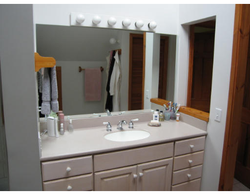 582 Pfersick Road Ashfield, MA 01370 - Photo 10 of 23 a bathroom with a sink vanity and a mirror