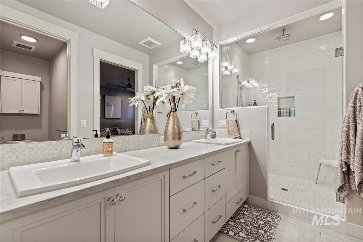 2616 West Neff Street Boise, ID 83702 - Photo 19 of 36 Bathroom with a stall shower, double vanity, light tile patterned flooring, and recessed lighting