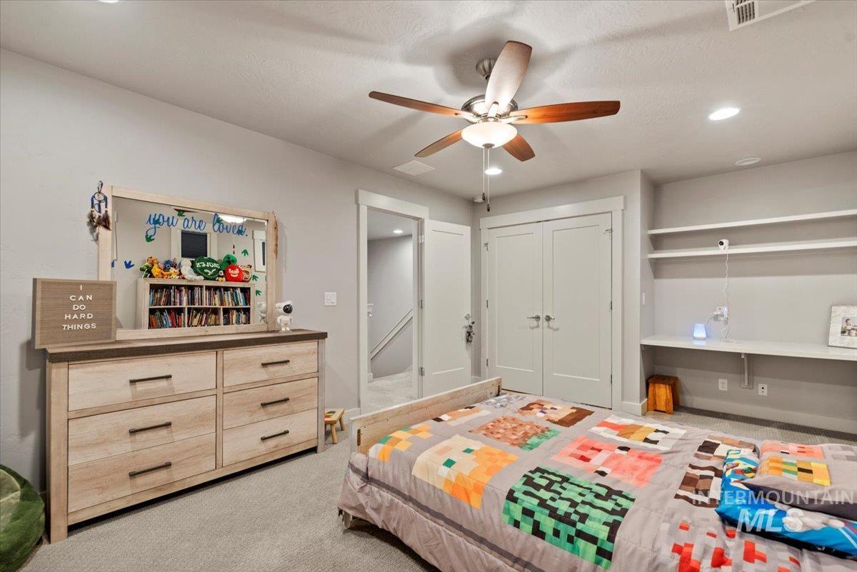 2616 West Neff Street Boise, ID 83702 - Photo 24 of 36 Bedroom with light colored carpet, recessed lighting, a closet, and ceiling fan