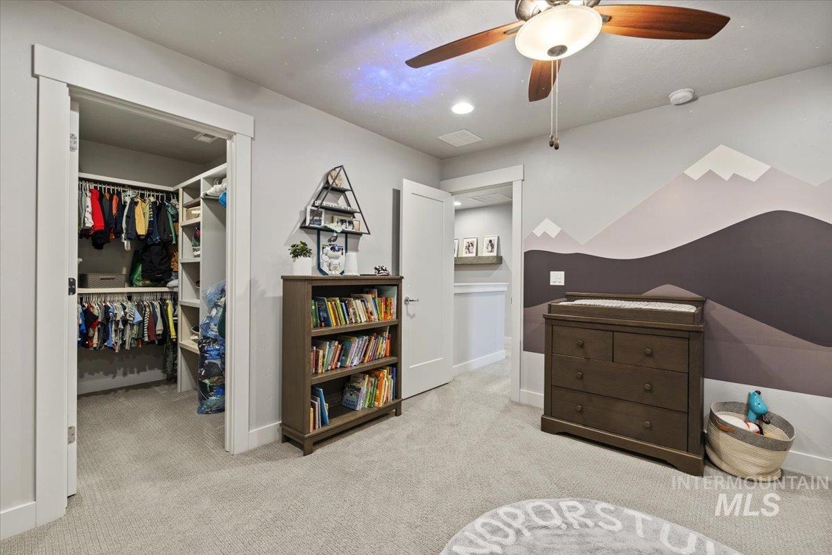 2616 West Neff Street Boise, ID 83702 - Photo 26 of 36 Bedroom featuring a walk in closet, light carpet, ceiling fan, and recessed lighting