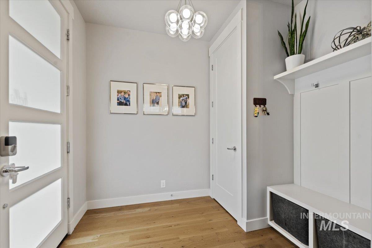 2616 West Neff Street Boise, ID 83702 - Photo 6 of 36 Mudroom featuring light wood-style flooring and a chandelier