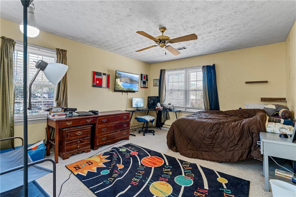 1500 Lake Dow Road McDonough, GA 30252 - Photo 20 of 42 a bed room with a bed and a window