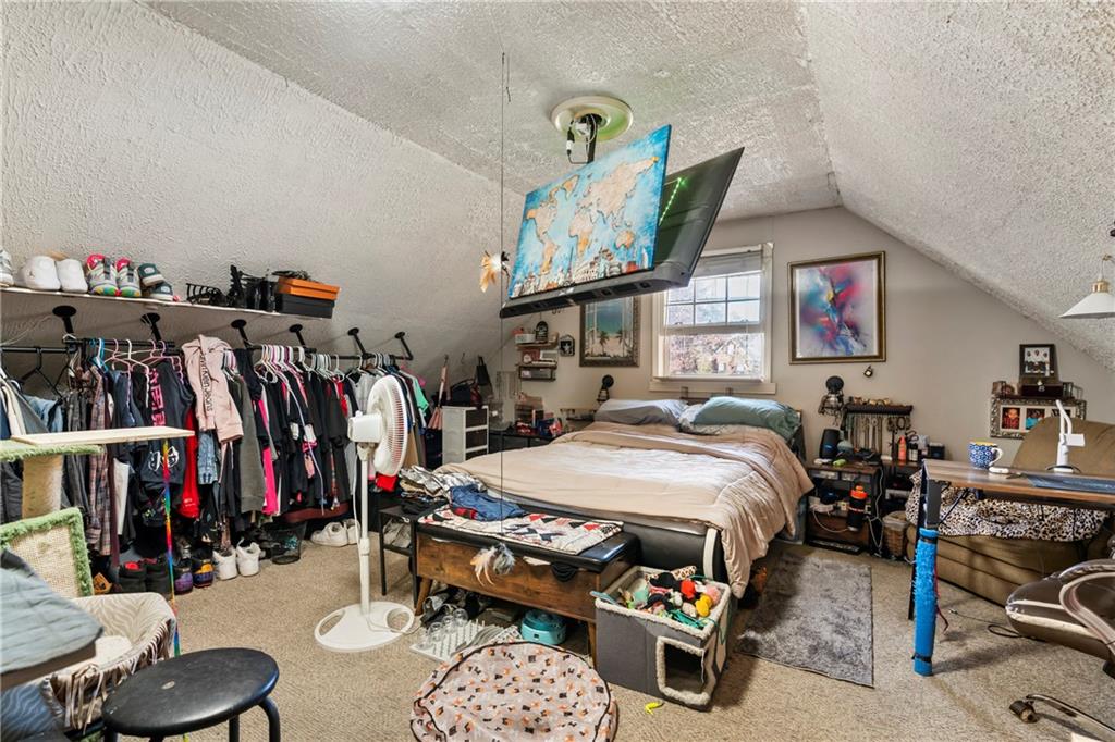 1500 Lake Dow Road McDonough, GA 30252 - Photo 23 of 42 a bed room with a bed a desk and chair