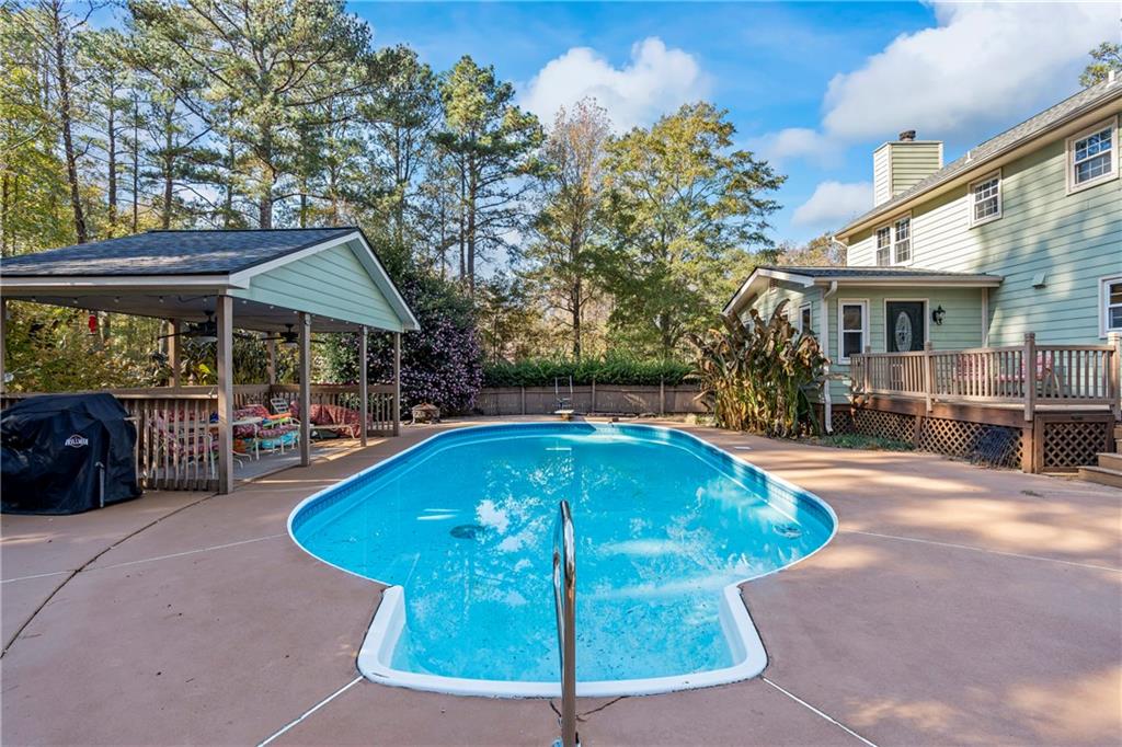 1500 Lake Dow Road McDonough, GA 30252 - Photo 29 of 42 a swimming pool with outdoor seating and yard