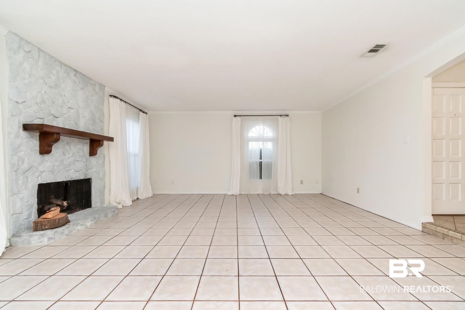 1508 Ridgeland Road East Mobile, AL 36695 - Photo 3 of 45 Unfurnished living room featuring a fireplace and visible vents