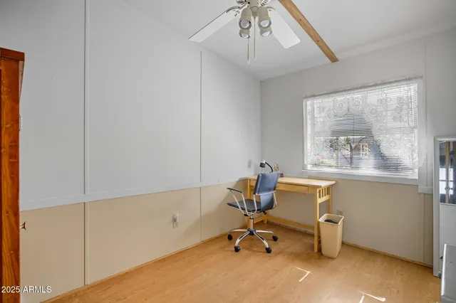a kitchen with a refrigerator and cabinets