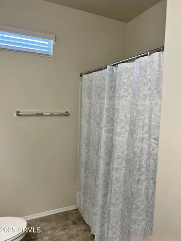 an empty room with closet area