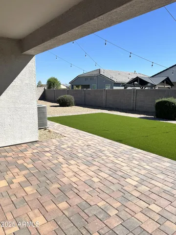 a large kitchen with stainless steel appliances granite countertop a refrigerator and a stove top oven