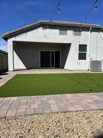 a view of kitchen with refrigerator and window