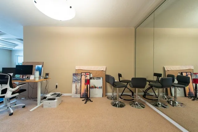 a view of a workspace with furniture