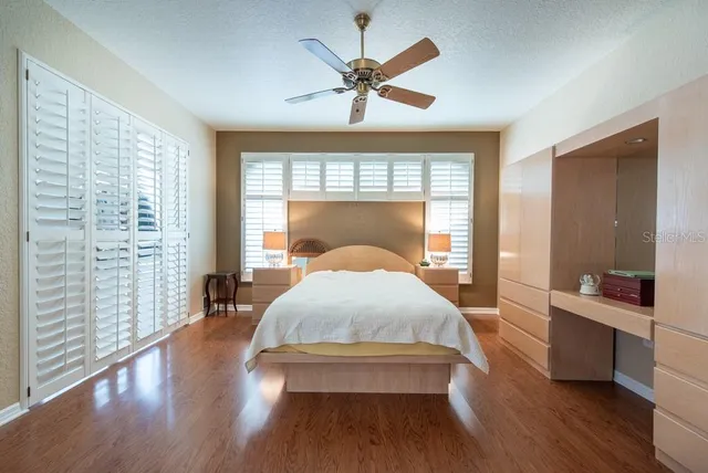 a bed room with a bed and a window