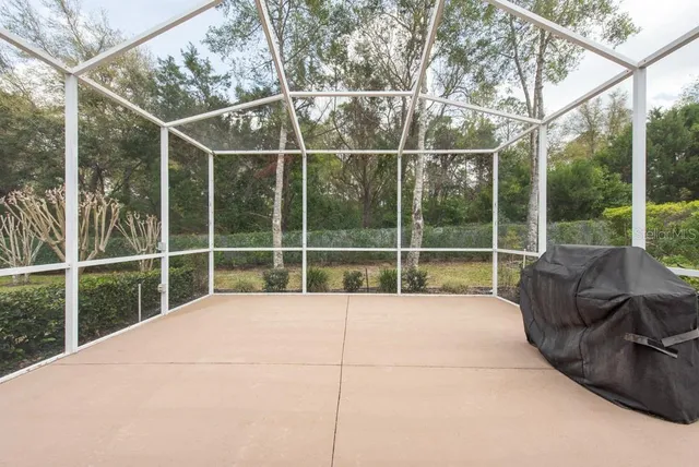 a view of a room with a large window and a couch