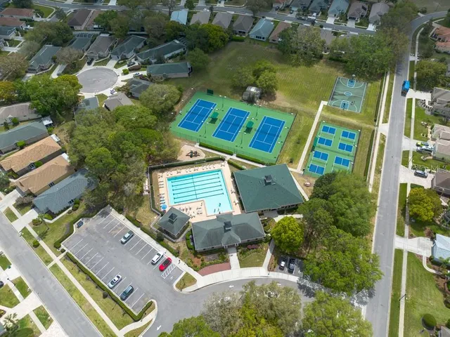 an aerial view of house with outdoor space and swimming pool