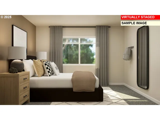 a living room with a bed and a large window