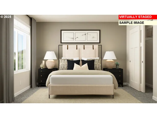 a living room with a bed furniture and a large window