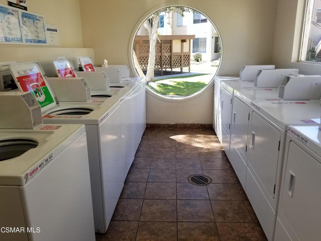 1754 Sinaloa Road, Unit 275 Simi Valley, CA 93065 - Photo 18 of 18 a view of a kitchen with a sink washer and dryer