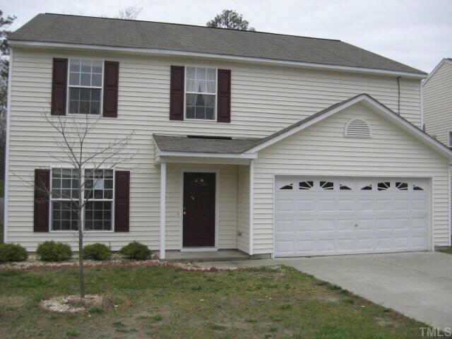 3925 Tyler Bluff Lane Raleigh, NC 27616 - Photo 1 of 5 a view of a house with a yard
