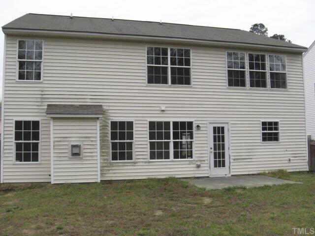 3925 Tyler Bluff Lane Raleigh, NC 27616 - Photo 2 of 5 a front view of a house with a yard