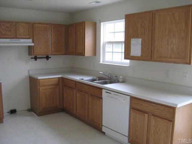 3925 Tyler Bluff Lane Raleigh, NC 27616 - Photo 4 of 5 a kitchen with a sink cabinets and window