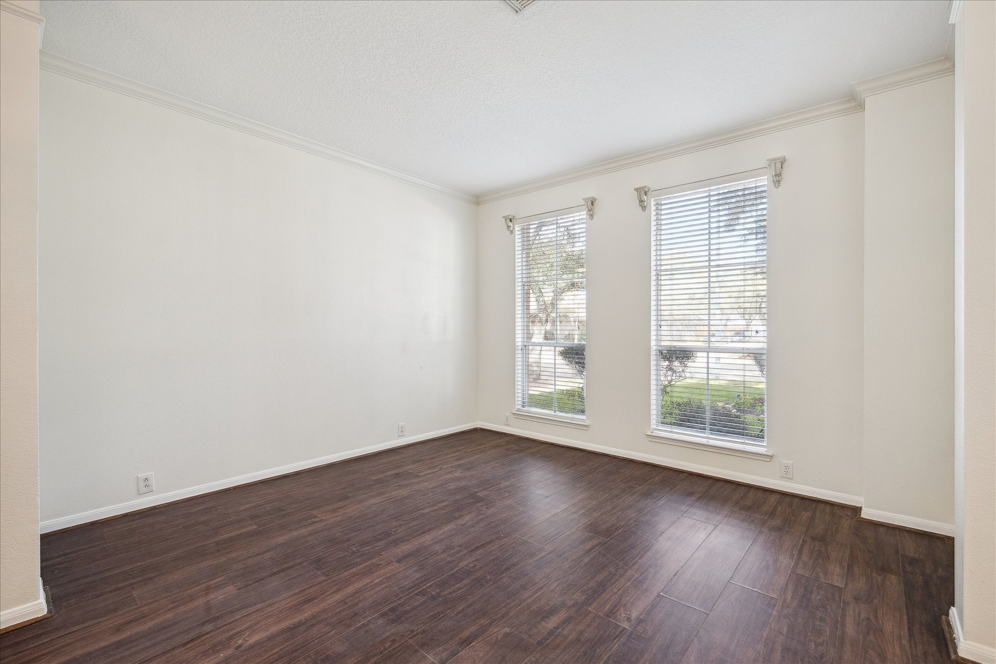 12831 Dove Point Lane Houston, TX 77041 - Photo 8 of 50 an empty room with wooden floor and windows