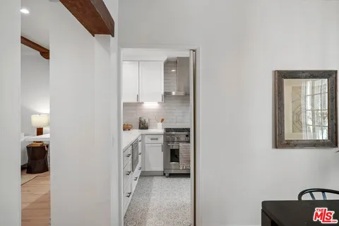 a kitchen with cabinets and a stove