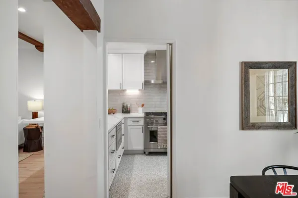 a kitchen with cabinets and a stove