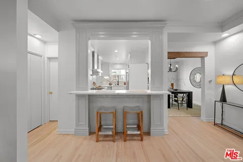 a open kitchen with a table and chairs