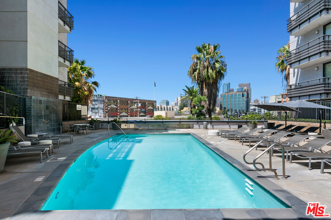 a view of a swimming pool with chairs