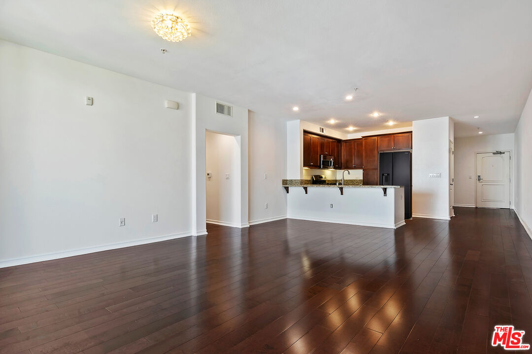 629 Traction Avenue, Unit 507 Los Angeles, CA 90013 - Photo 13 of 52 a view of a kitchen with a sink and a refrigerator