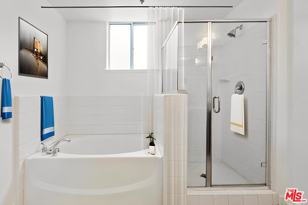 629 Traction Avenue, Unit 507 Los Angeles, CA 90013 - Photo 19 of 52 a bathroom with a bathtub and a shower