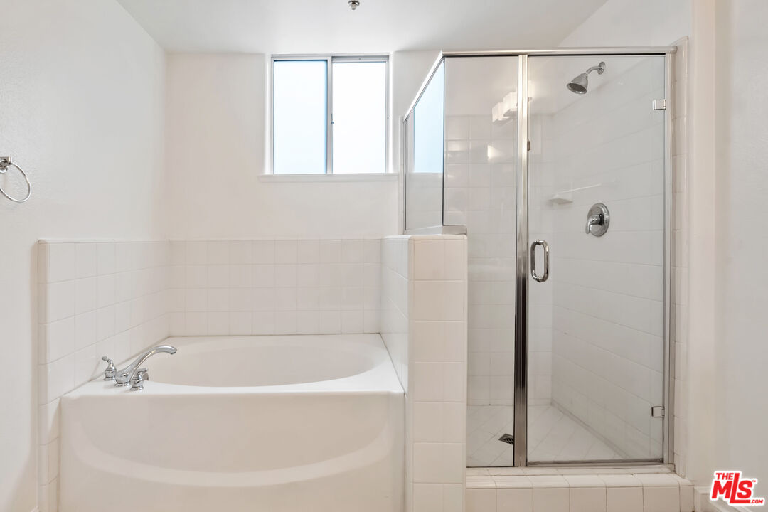 629 Traction Avenue, Unit 507 Los Angeles, CA 90013 - Photo 20 of 52 a bathroom with a bathtub and a shower
