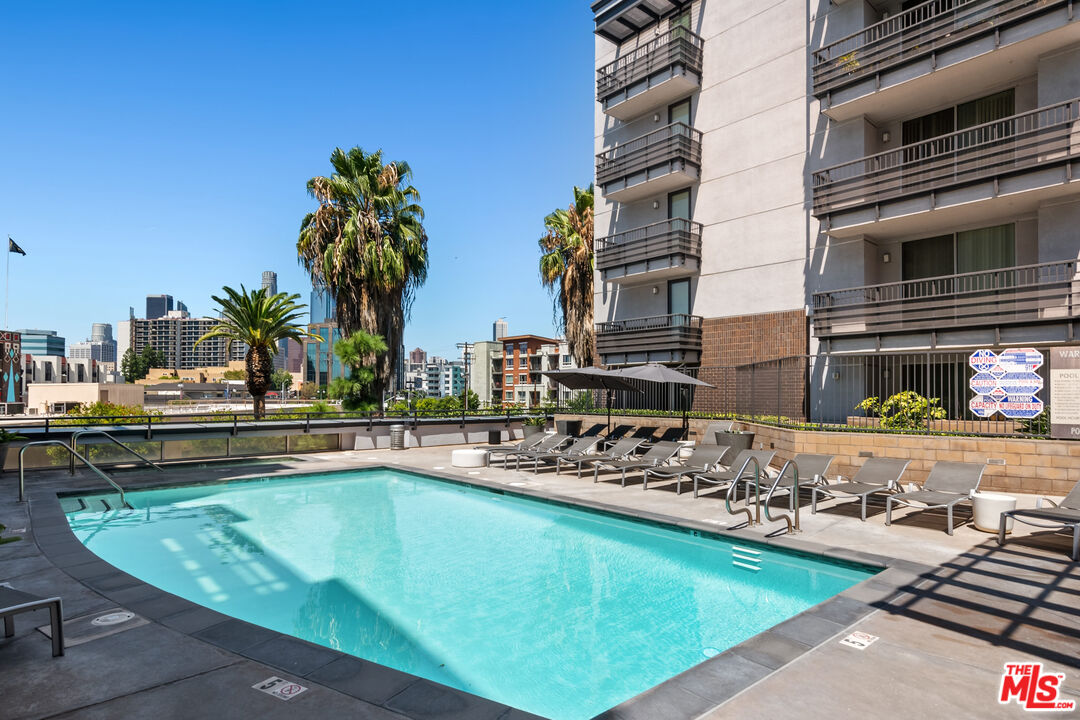 629 Traction Avenue, Unit 507 Los Angeles, CA 90013 - Photo 31 of 52 a view of a swimming pool with a lounge chairs