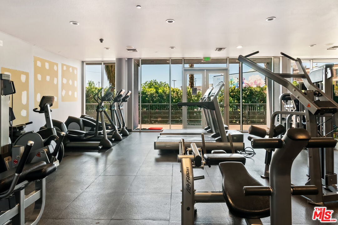 629 Traction Avenue, Unit 507 Los Angeles, CA 90013 - Photo 34 of 52 a living room with furniture large windows and flat screen tv