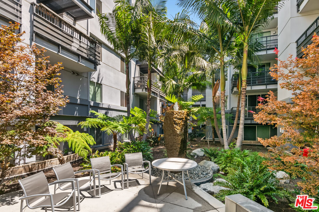 629 Traction Avenue, Unit 507 Los Angeles, CA 90013 - Photo 47 of 52 a view of a chair and table in backyard of the house