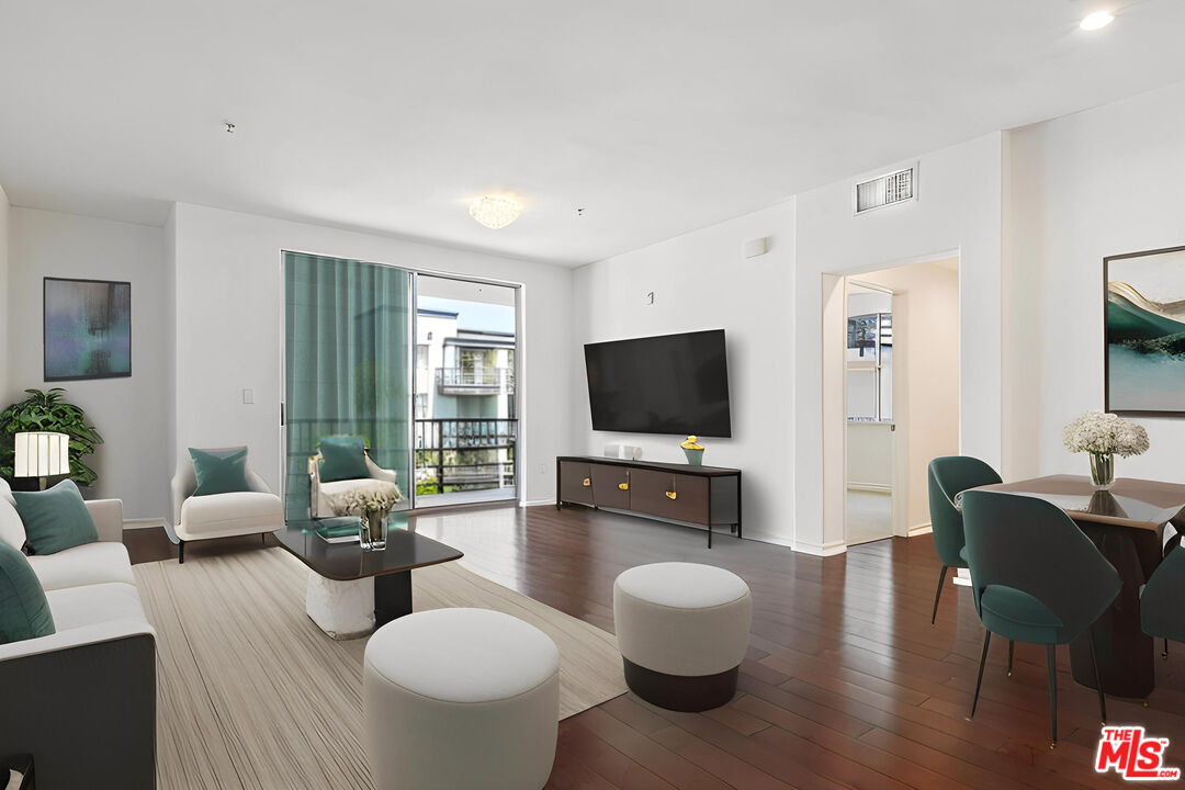 629 Traction Avenue, Unit 507 Los Angeles, CA 90013 - Photo 8 of 52 a living room with furniture and a flat screen tv