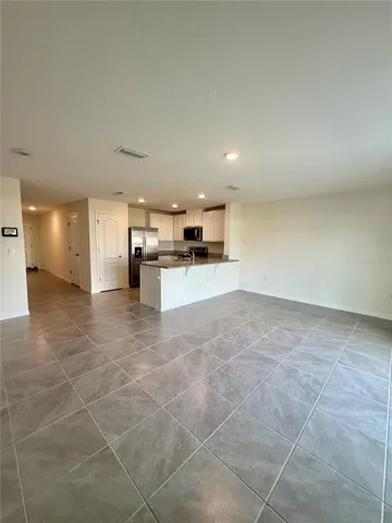 a view of a kitchen with a sink and a stove top oven