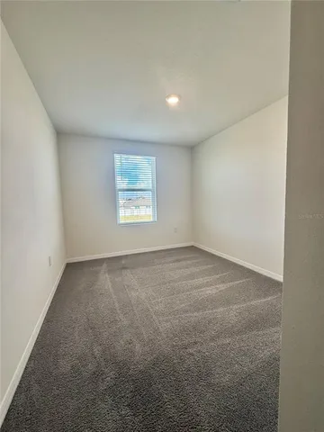 a room with furniture and a window