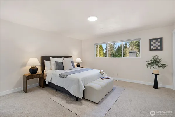 a bedroom with bed and a window