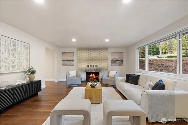 a living room with furniture fireplace and window