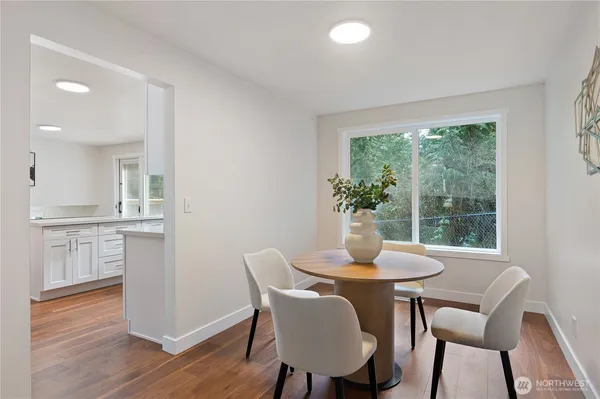 a dining room with furniture window wooden floor